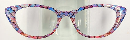 Cute cat-eye eyeglasses with a colorful mosaic patterned frame, displayed on a clear acrylic stand against a plain white background.