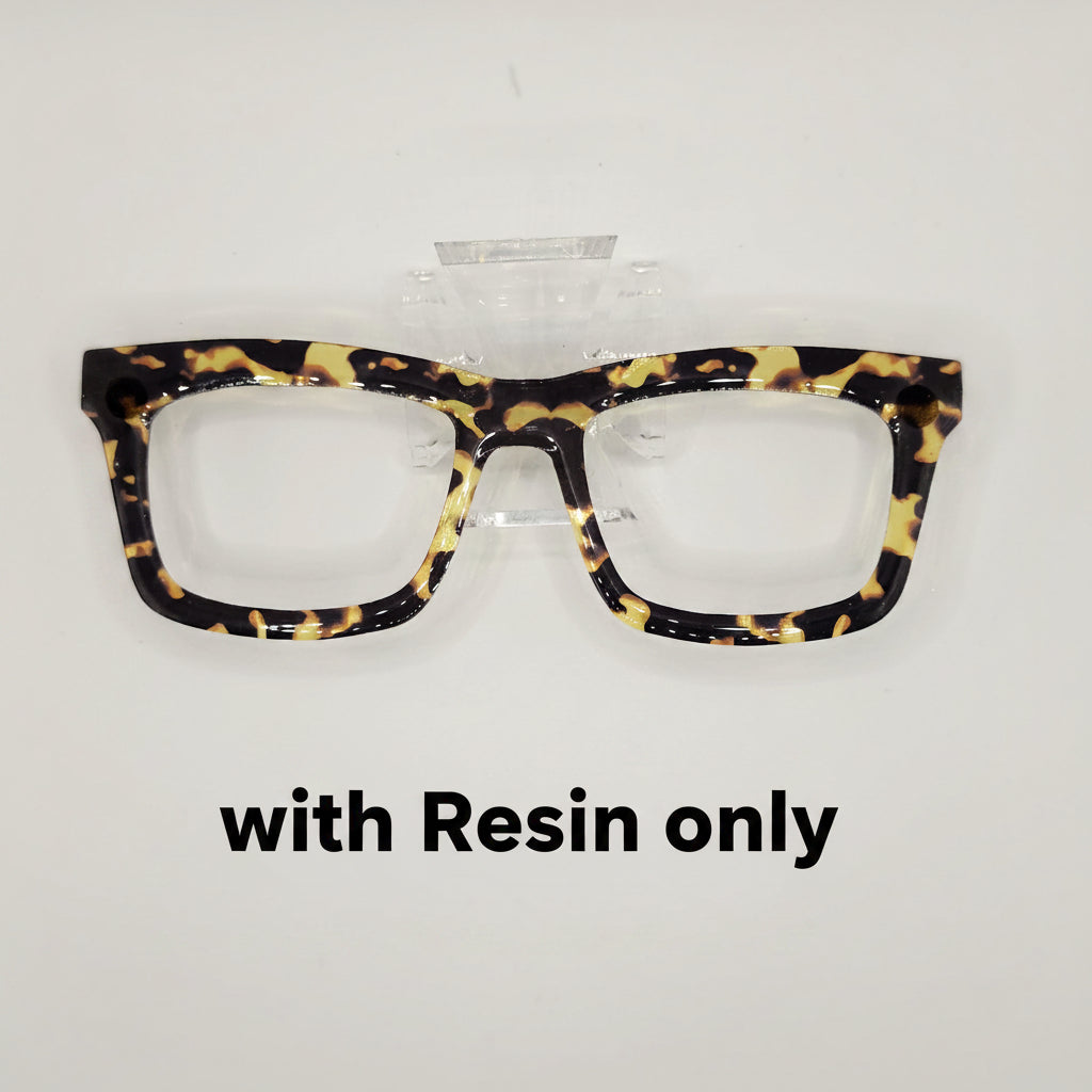 Tortoiseshell eyeglasses with a glossy black, brown, and yellow mottled pattern, displayed on a clear plastic stand against a light gray background.