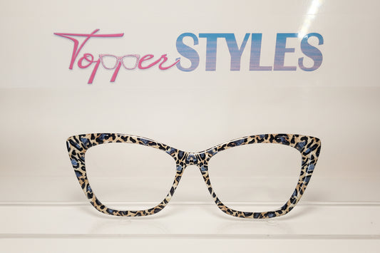 Leopard print eyeglass frame with 'Topper Styles' branding on a white background