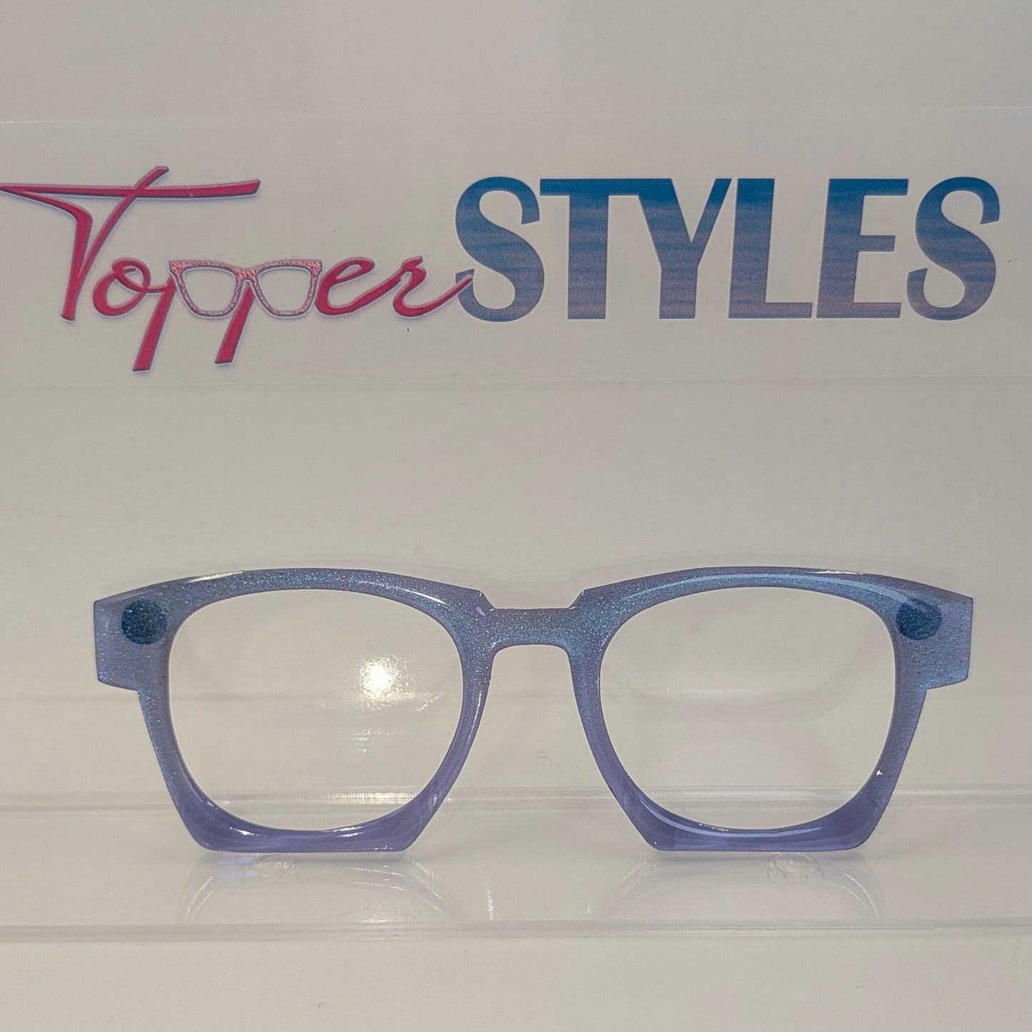 Blue eyeglasses on a white background with 'Topper Styles' branding.